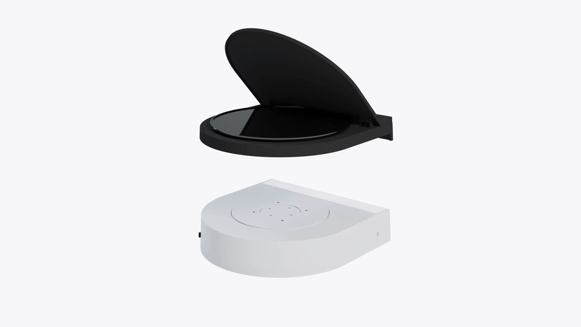 A hand placing the black GemLightbox Eclipse cover onto the turntable base.