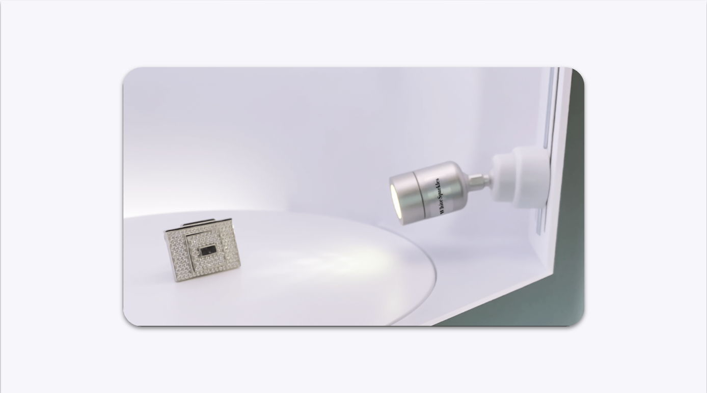 A diamond ring inside a GemLightbox Pro illuminated by the White Sparkle light.